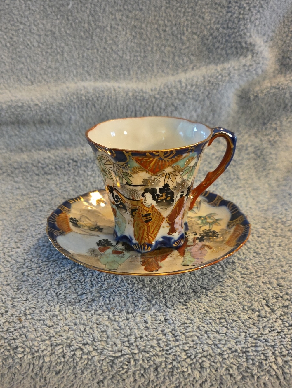 Vintage Japanese hand-painted porcelain demitasse or chocolate cup and saucer